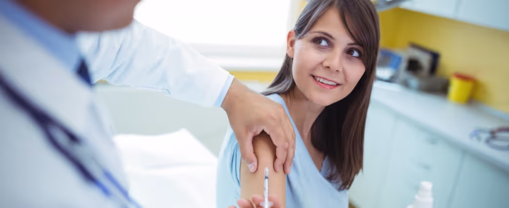 best time to get a flu shot: woman getting a flu shot