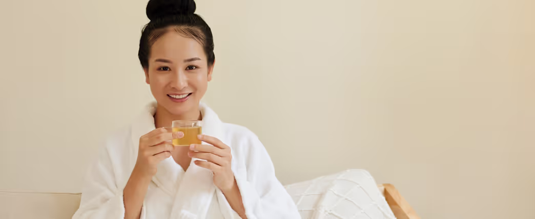Woman drinking chamomile tea to help her sleep better