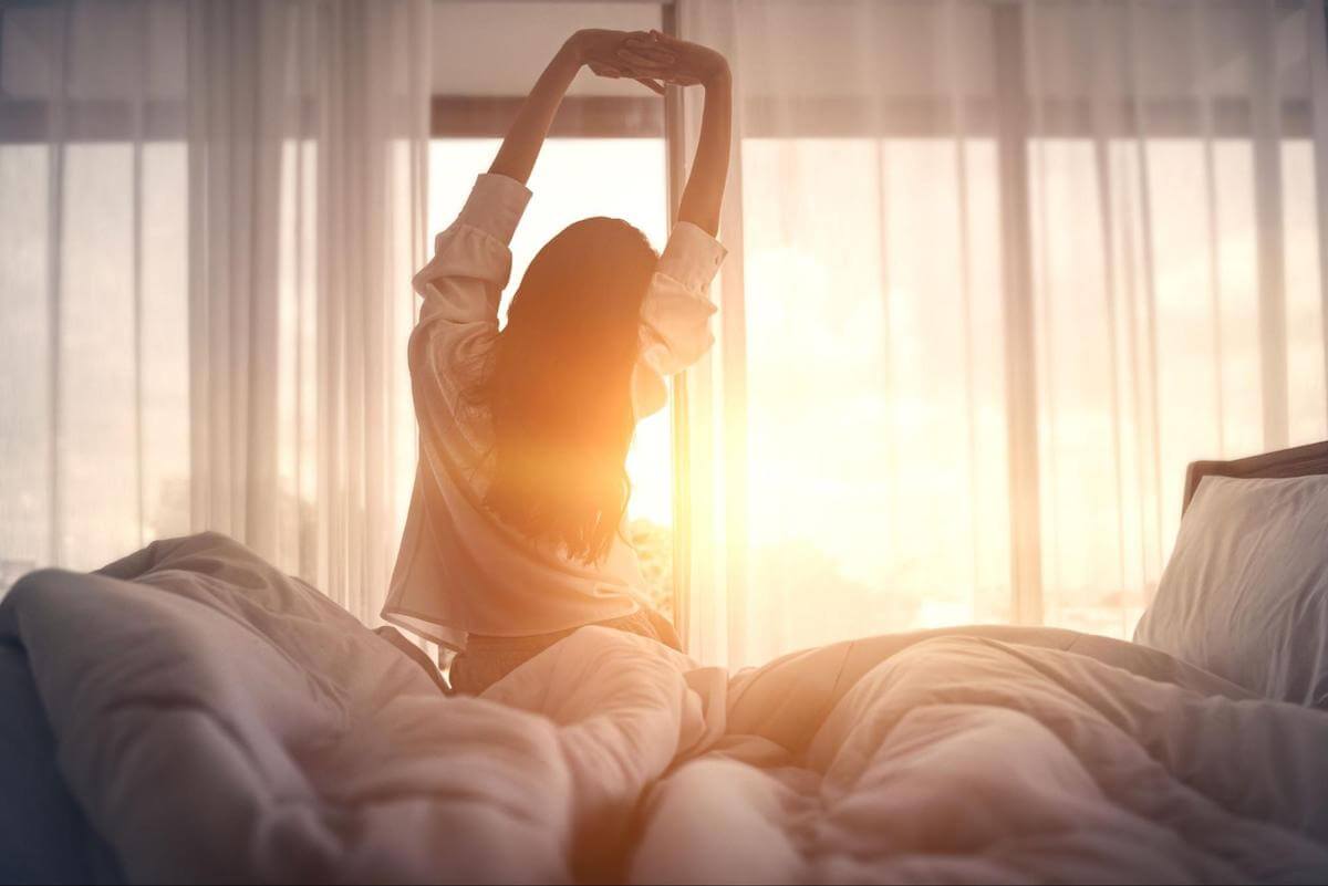 Woman stretching upon waking up
