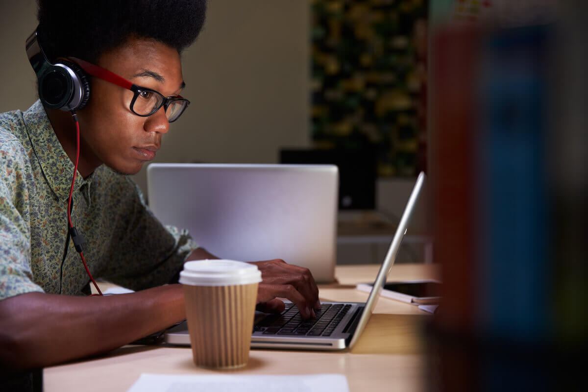 Chronotype: guy with a cup of coffee, working on his laptop